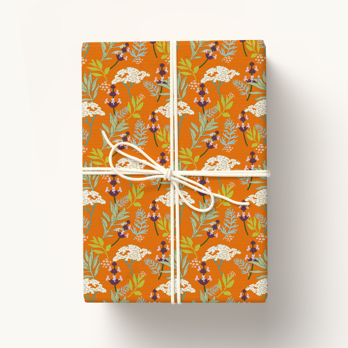 Gift wrap for nature lovers featuring illustrated native California wildflowers, printed on eco-friendly paper.