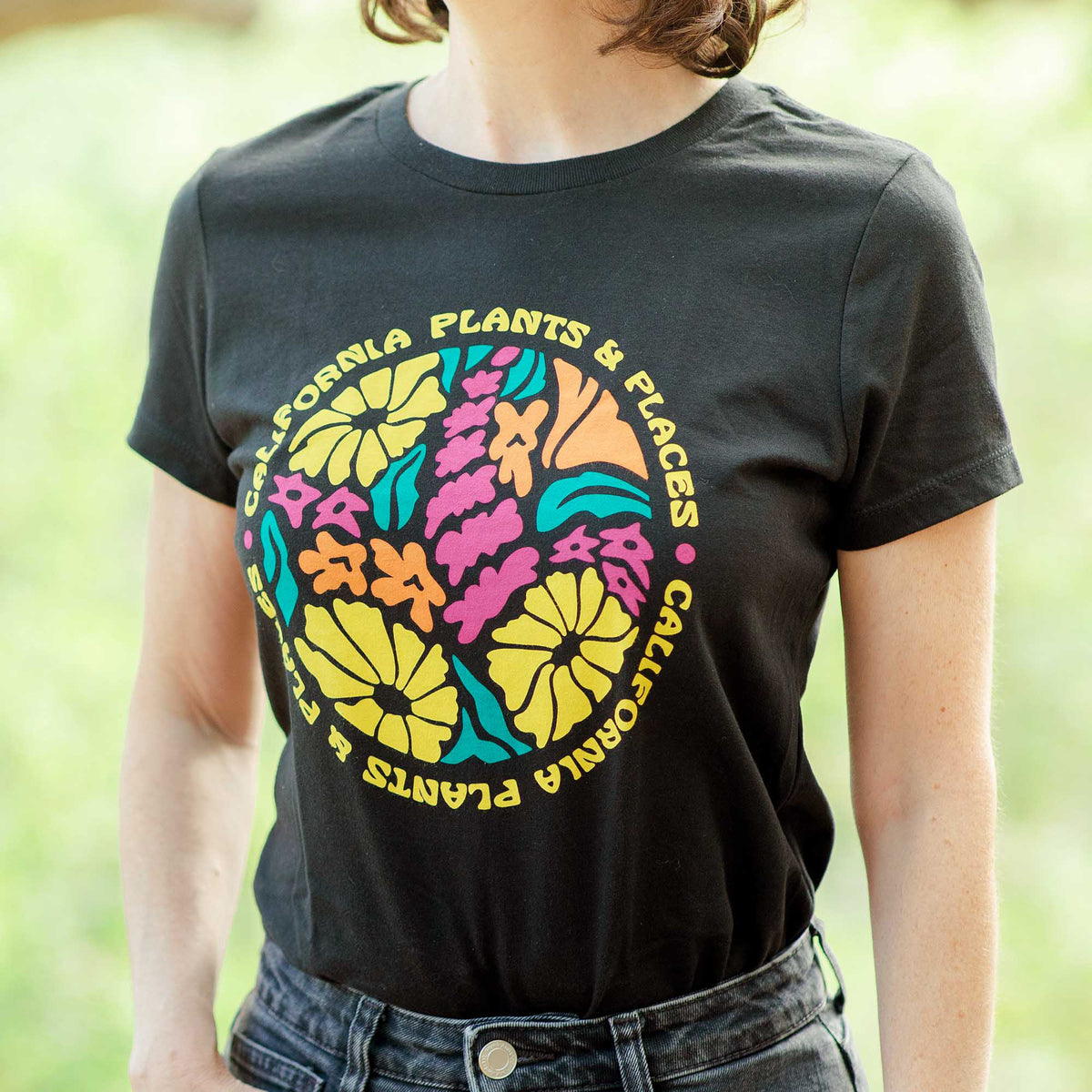 Close-up of the California Plants Tee, showcasing the colorful illustration of native California wildflowers.