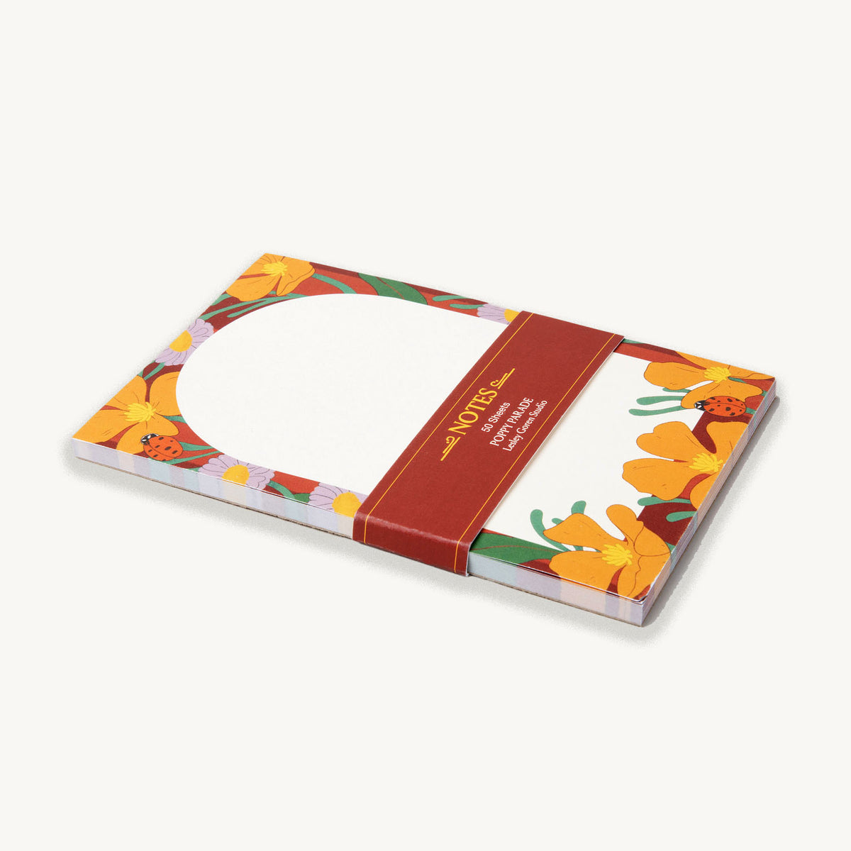 cute notepad with floral design on a white background belly band