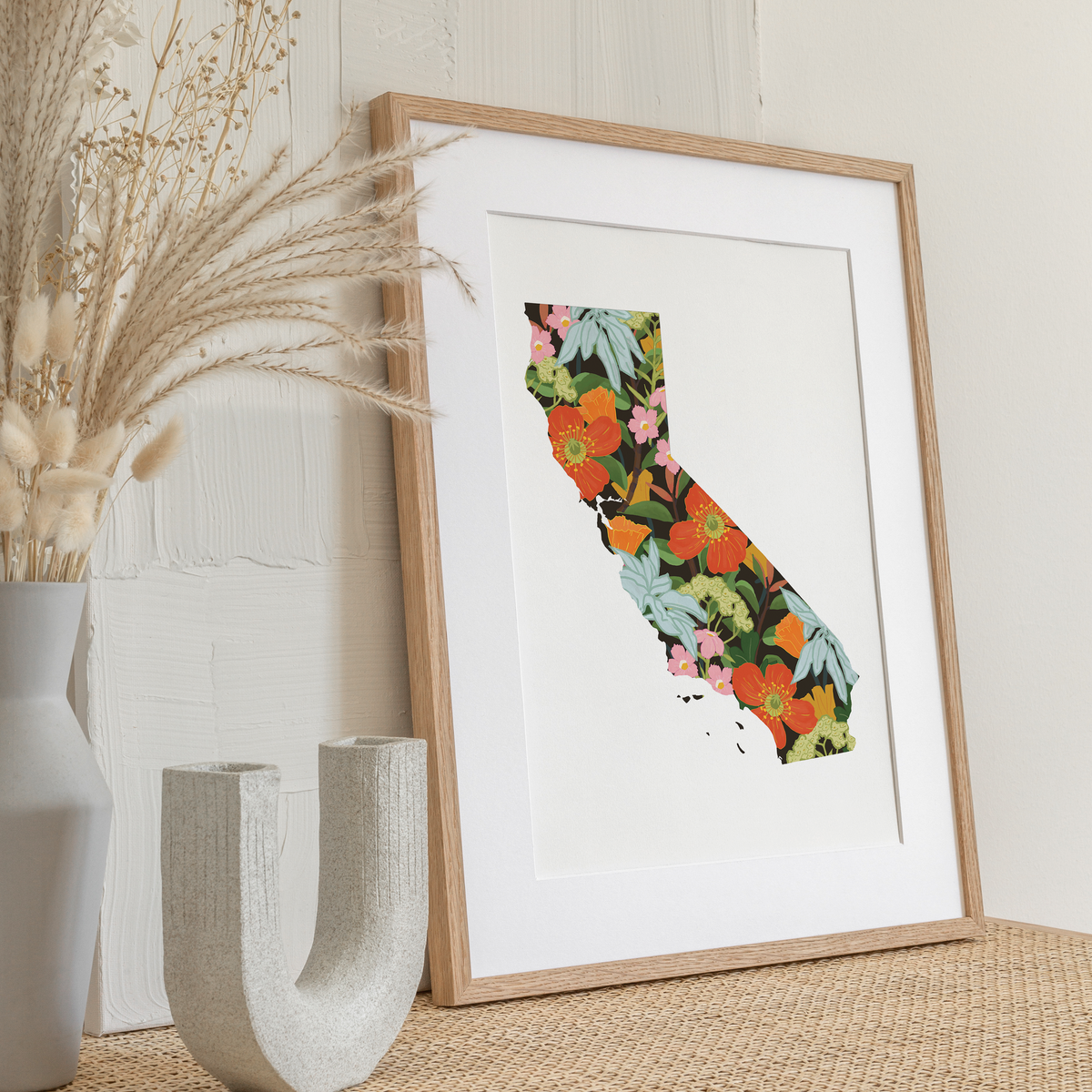 Wild California Art Print styled on a wall, highlighting its bold and colorful design of native wildflowers.