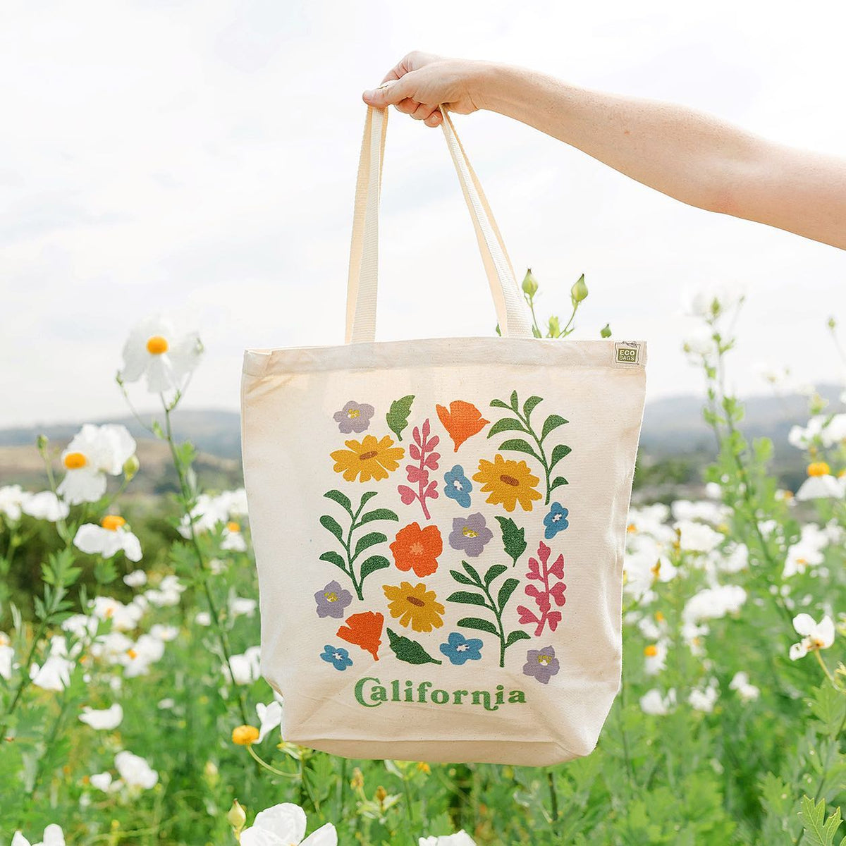 Front view of the Wildflowers Tote featuring colorful California native wildflowers on cotton fabric.